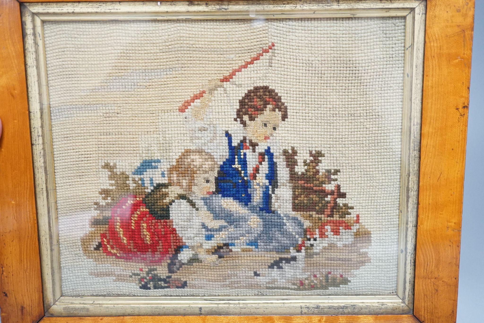 A Victorian maple framed woolwork picture, children playing with cats and dogs, 20x25cm excl frame